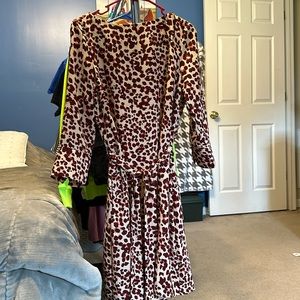 Silky but nice material. With fabric belt